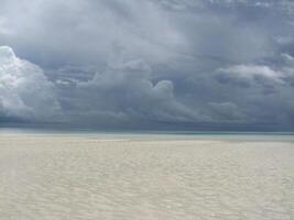 Amazing view of the cloudy sky over the Indian Ocean on a stormy day from Nungwi sandy beach, Zanzibar, Tanzania photo