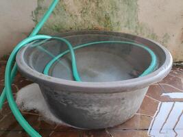 overflowing bucket full of water photo