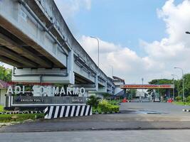 Low angle view of the railway line connecting Adi Soemarmo Airport - Balapan Solo Station in Surakarta, Indonesia photo