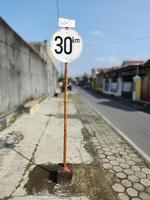 speed limit sign at the village entrance photo