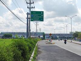 Low angle view of the railway line connecting Adi Soemarmo Airport - Balapan Solo Station in Surakarta, Indonesia photo