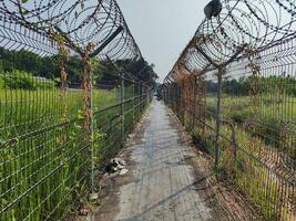 A connecting road between villages dividing the prohibited entry area at Adi Soemarmo Airport, Surakarta photo