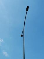 a low angle view of street light at the Adi Soemarmo Airport intersection in Surakarta, Indonesia photo