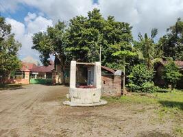 An old water well in a village photo