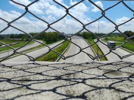 High angle view of toll road through safety wire at flyover in Boyolali, Indonesia photo