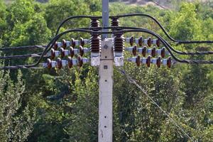 Insulators on electric poles are devices used to support wires. and prevent electrical leakage photo