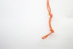 Rubber bands looped together in a chain. white background copy space photo