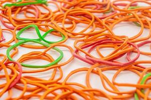 a bunch of messy rubber bands on a white background photo