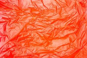texture of orange plastic bag crumpled. Copy space photo