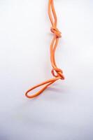 Rubber bands looped together in a chain. white background copy space photo