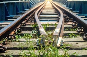 a retaining rail on a railroad track with a small gauge photo