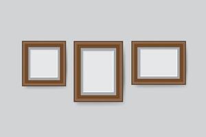 wooden blank picture photo frames stand on a clear wall from the front vector