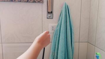 Woman Pluggin In The Electrical Outlet Of The Dryer video