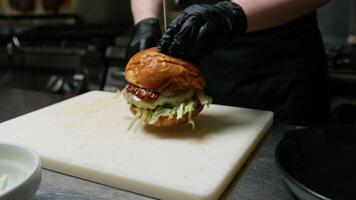 Using The Spatula To Plate The Burger Dish video