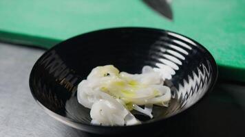 Oil And Salt Over A Bowl With Cuttlefish video