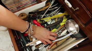 Hand Searching For The Right Tool In The Drawer video