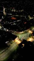 aéreo vertical cenas do iluminado leitão urubu Cidade do Inglaterra durante noite. Inglaterra Unidos reino, marcha 29, 2024 video