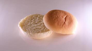 Cross-section of a round loaf of bread preparing a sandwich close-up baking bread with an even cut in the center video