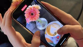 Shooting a coffee blog with a heart and beautiful flowers on your mobile phone video