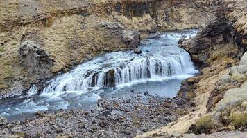 A wide shot capturing the stunning Rollutorfufoss waterfall in Iceland. video