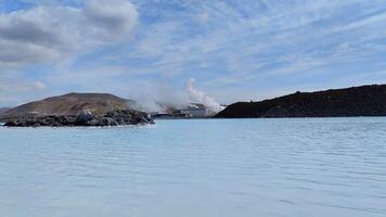 A stunning view of the Blue Lagoon's turquoise waters with a geothermal reactor in the background video