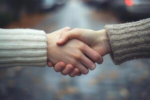 the moment of a handshake between two people professional photography photo