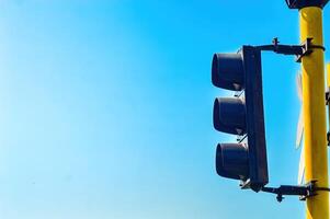 railway crossing signal lights with bright blue sky copy space background photo