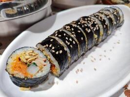 a plate of kimbap roll or sushi roll. perfect for menu and food content photo