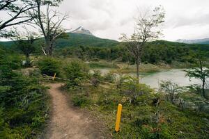 lake in Bahia Lapataia amidst mountains at Tierra del Fuego photo