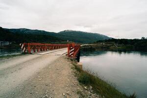 lake in Bahia Lapataia amidst mountains at Tierra del Fuego photo