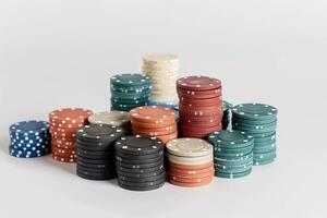 A large number of multi-colored poker chips. Big wins and excitement of the game photo