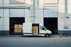 Side photo of white van. Concept of logistics and delivery of small cargo and parcels