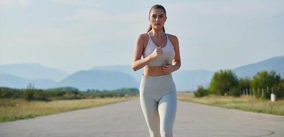 A determined woman athlete trains for success in the morning sun. photo