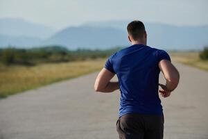 Determined Stride. Athletic Man Embarks on Marathon Preparation with Resolve. photo