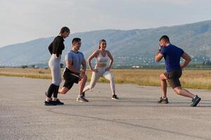 Diverse Group of Athletes Prepare Together for a Run photo