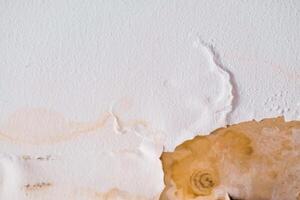 Water damaged ceiling roof, brown stain, office building photo