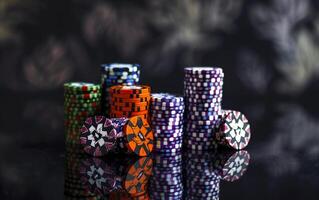 A large number of multi-colored poker chips. Big wins and excitement of the game photo