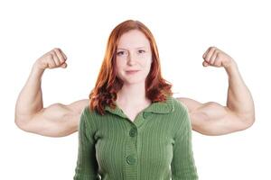 young woman flexing muscles photo