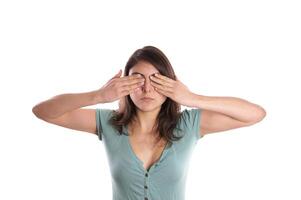 woman covering her eyes photo