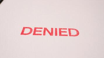 16 photo of red denied stamp on white document paper