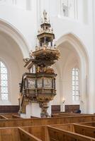 Beautiful golden pulpit in St Petri church, Malmo. photo