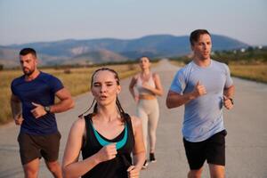 A group of friends maintains a healthy lifestyle by running outdoors on a sunny day, bonding over fitness and enjoying the energizing effects of exercise and nature photo