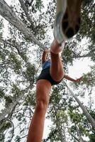 Adventurous Woman Overcoming Forest Obstacles with Determination and Agility. photo