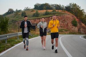 Running towards a common goal, a group of colleagues braves the misty morning air, their determination evident in every stride. photo