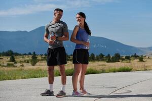 After-Run Relaxation. Romantic Couple Rests Following Intense Training Session. photo