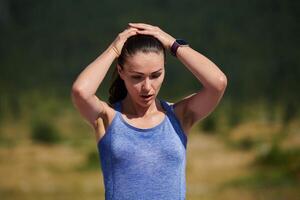 Post-Run Rest. Athlete Relaxing After Intense Workout on a Sunny Day. photo