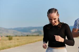 A determined woman athlete trains for success in the morning sun. photo