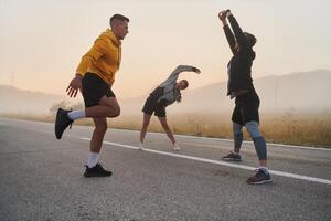 Diverse Athletes Prepare. Dynamic Group Warms Up for Morning Run. photo