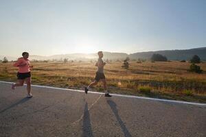 Energized by the beauty of nature, a couple powers through their morning run, their bodies and spirits invigorated. photo