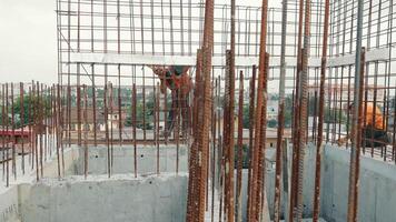 An engineer installs metal structures during the construction of a house. video